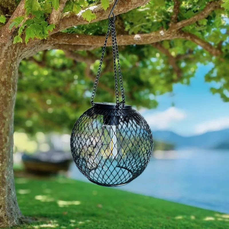 Solar wrought iron lantern lamp retro net chandelier outdoor garden decoration hollow lantern - الصورة 3