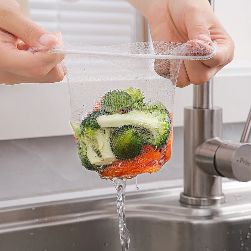 1PC Kitchen Sink Vegetable Fruit Drainer Basket Rack 50pcs Drain Strainer Kitchen Accessories Storage Sink Filter Shelf - الصورة 3
